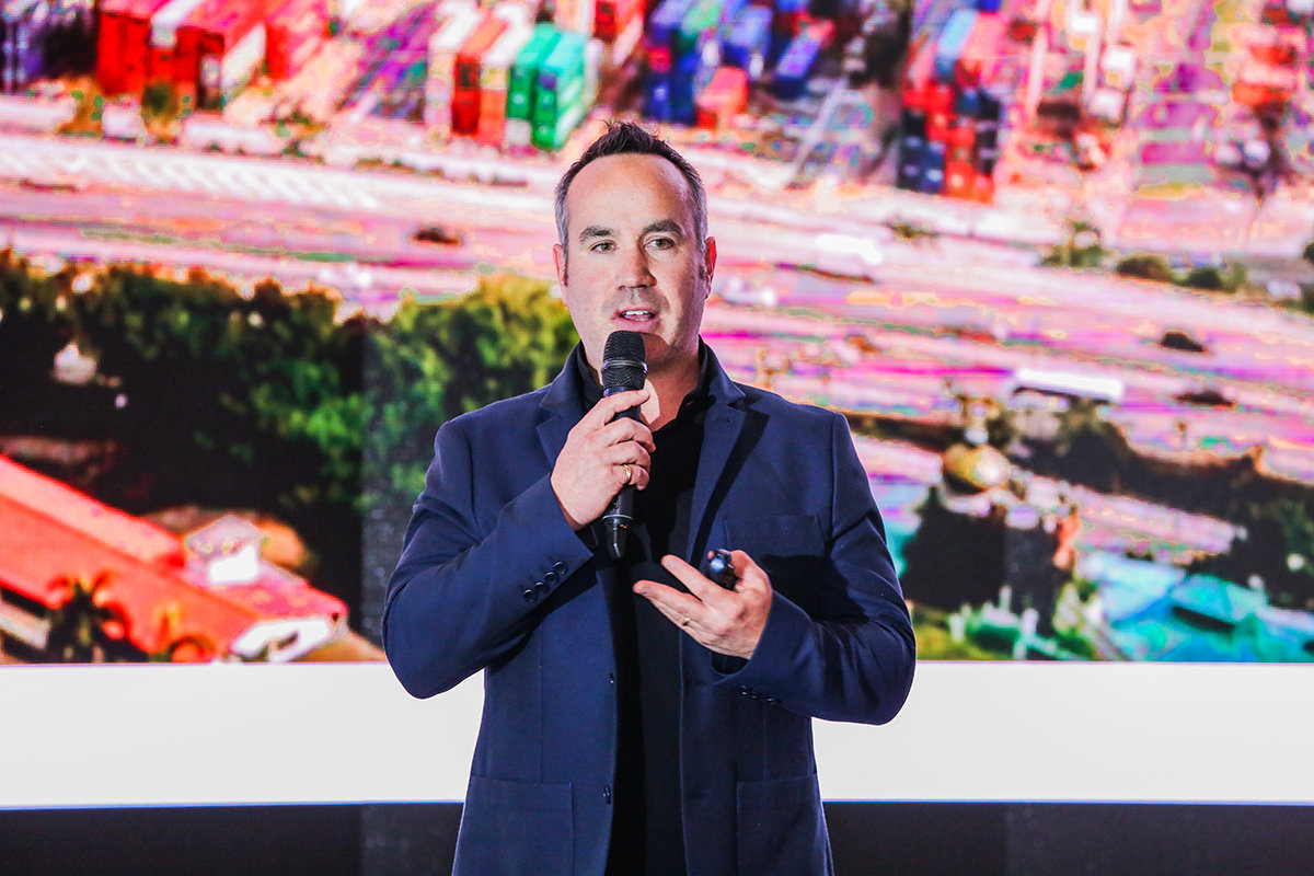 On stage delivering a technology keynote.